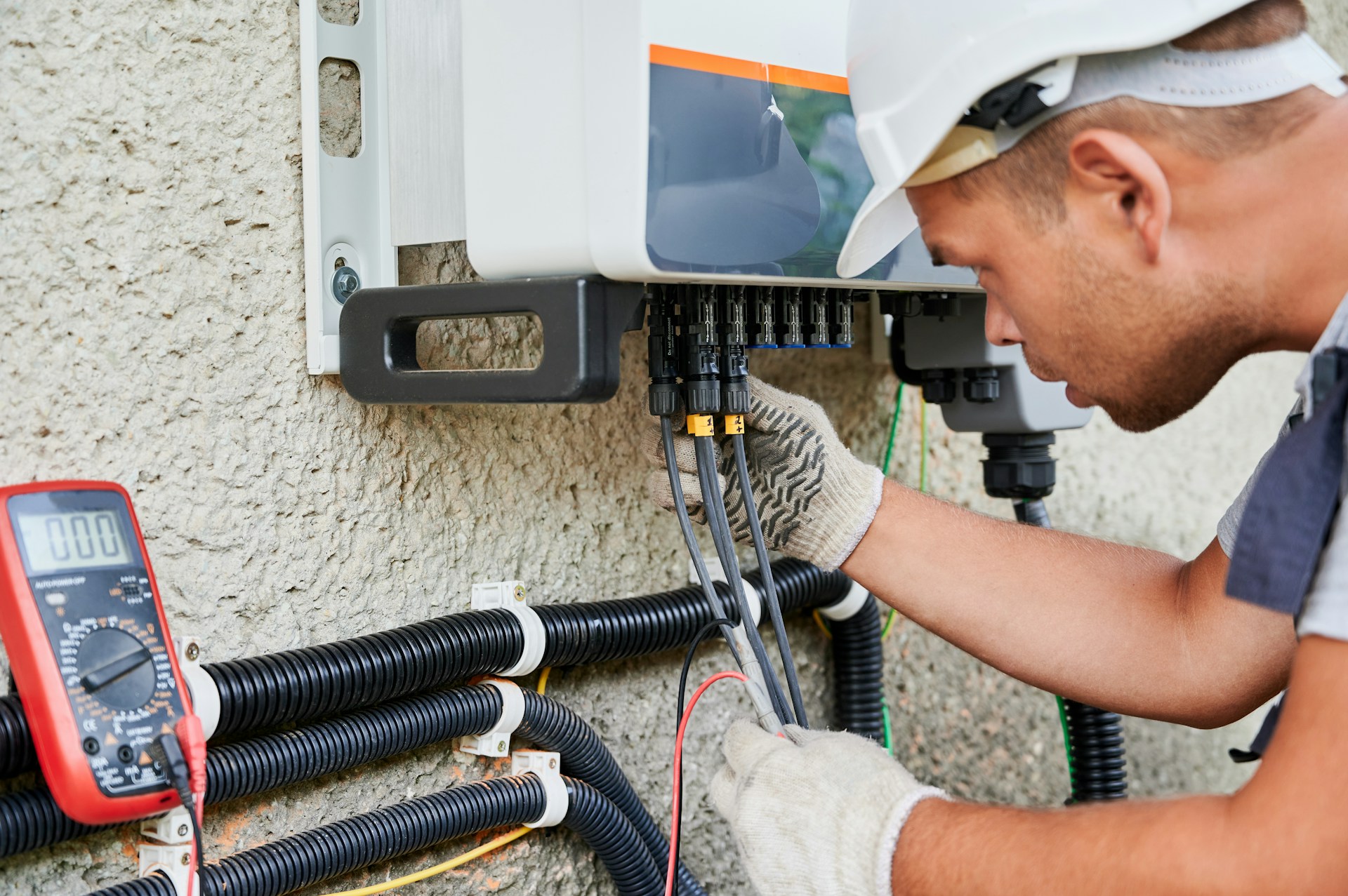 Professional electrician working on electrical panel